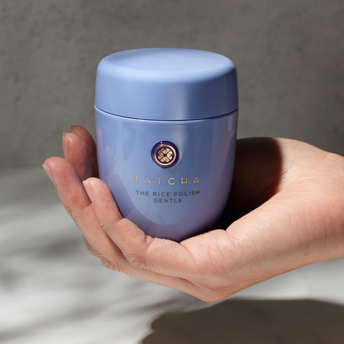 Hand holding the Rice Polish: Gentle