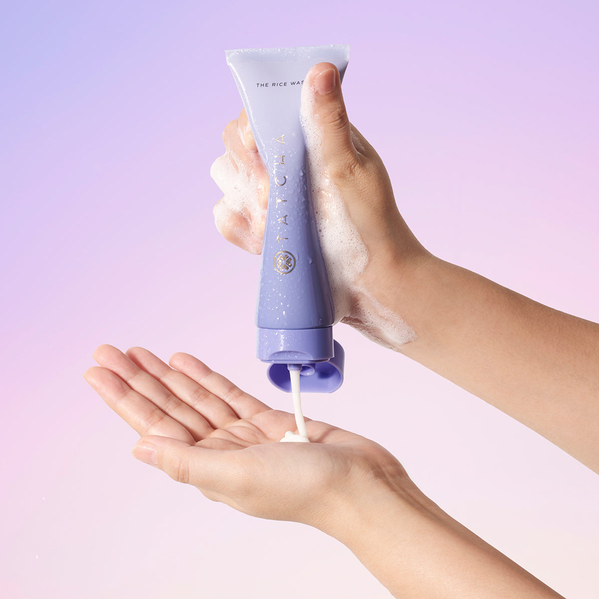 Hand squeezing the Rice Wash tube