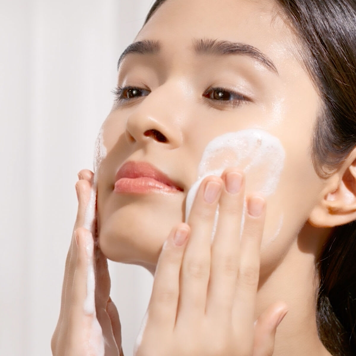 Woman washing face