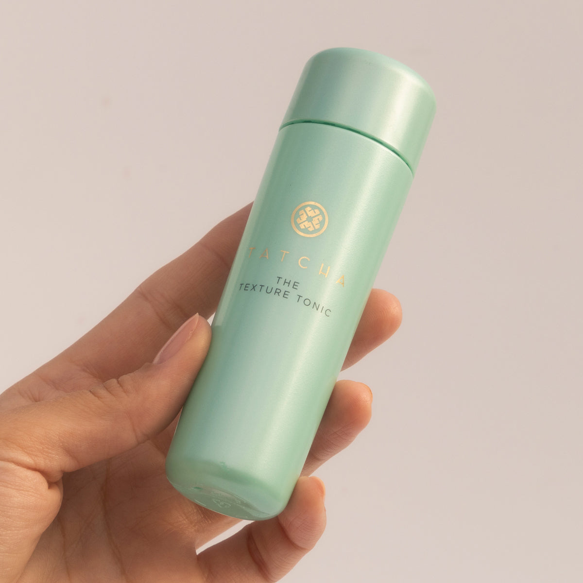 Hand holding Mini Texture Tonic
