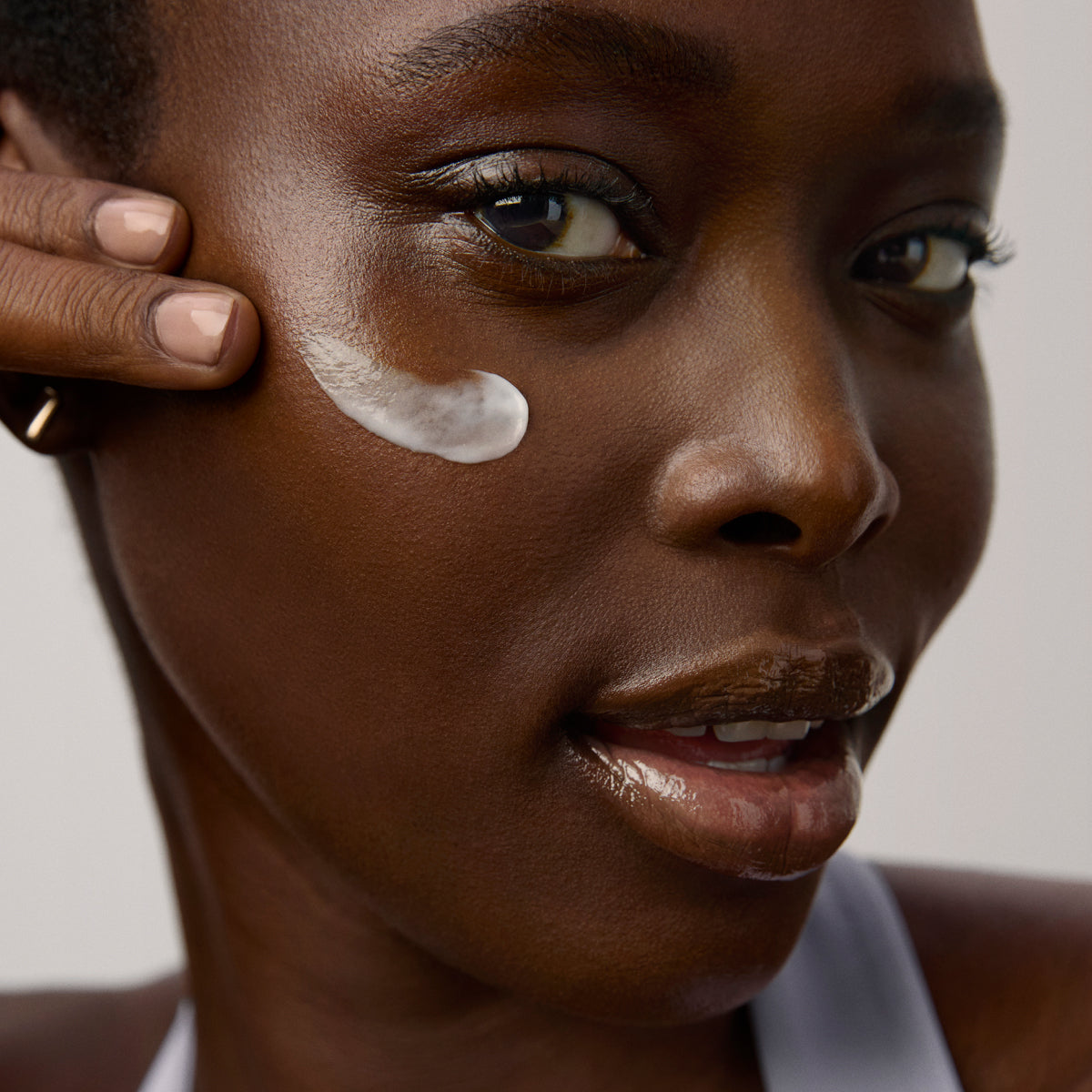 Model application showcasing the Tatcha Water Cream