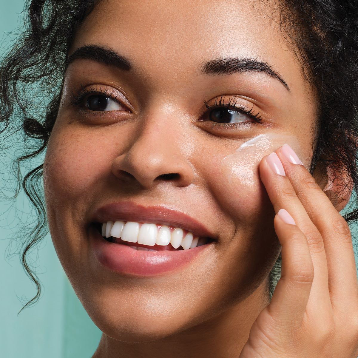 Woman applying The Water Cream to her face